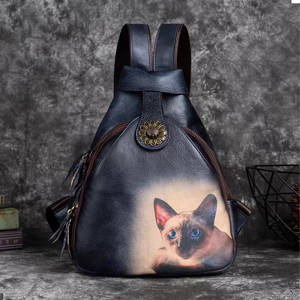 Vintage backpack with small cat design